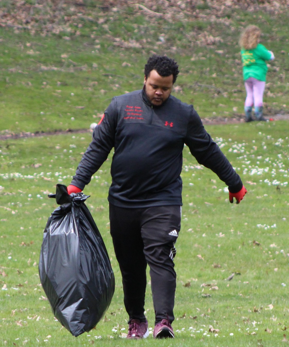 Community volunteer collecting litter outdoors